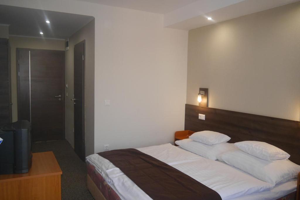 Postel nebo postele na pokoji v ubytování Hotel Tagore
