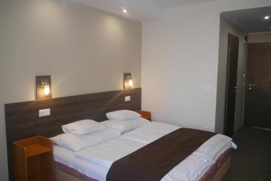 Postel nebo postele na pokoji v ubytování Hotel Tagore