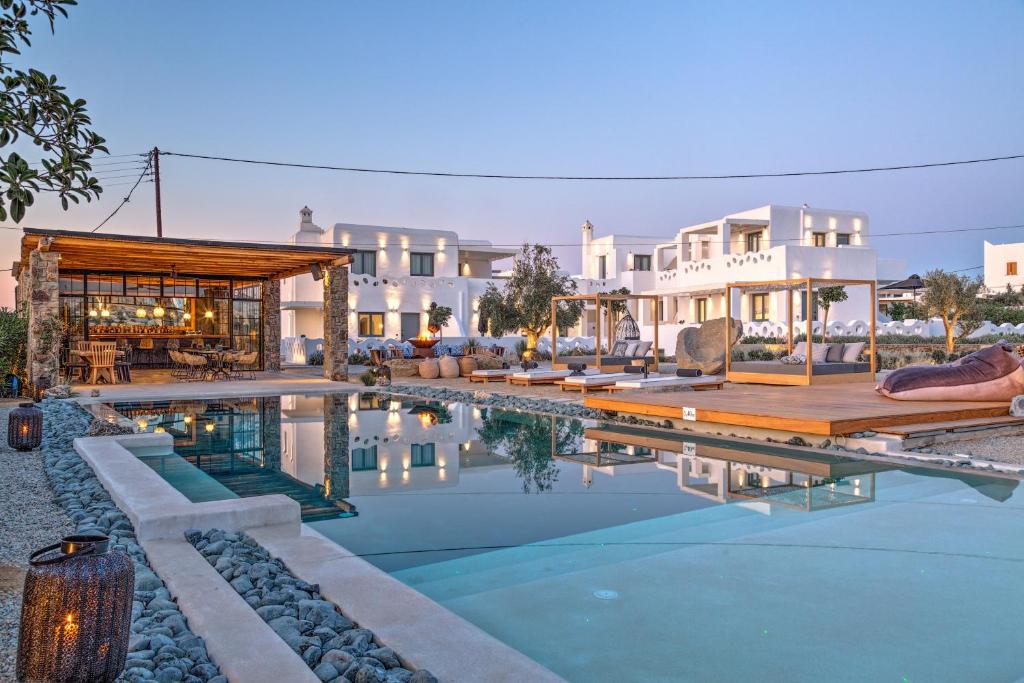 a swimming pool in front of a villa at Portes Suites & Villas Mykonos in Mýkonos City