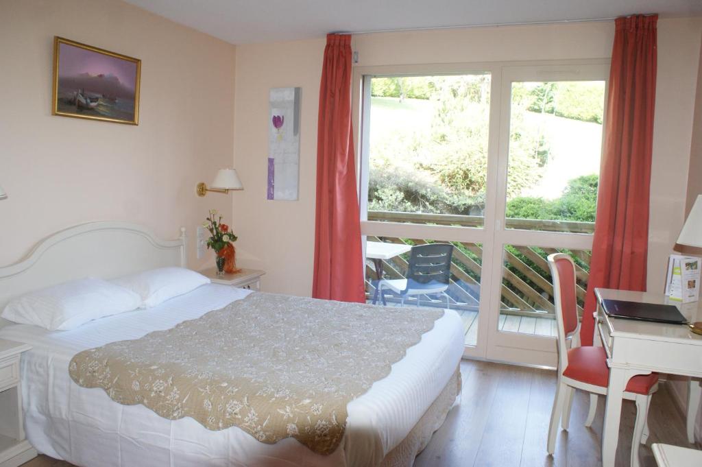 Postel nebo postele na pokoji v ubytování Hotel Blanc