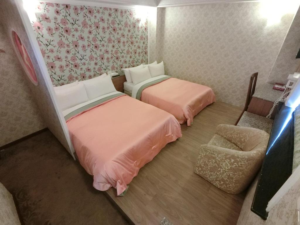 Postel nebo postele na pokoji v ubytování Nice Hotel