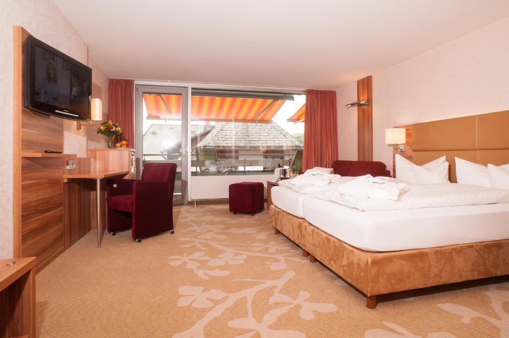 Postel nebo postele na pokoji v ubytování Albtalblick Ihr Wellness- & Wanderhotel