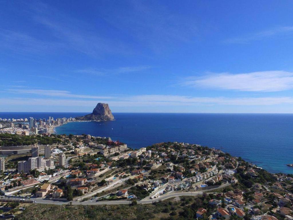 an aerial view of a city and the ocean at Villa Romeo in Calpe