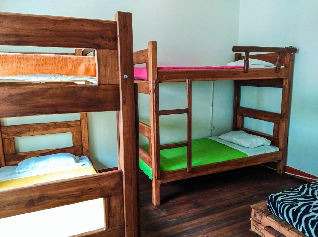 Postel nebo postele na pokoji v ubytování Hostal CQ Chapinero