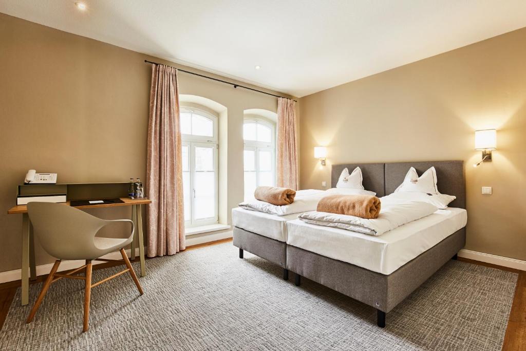 Postel nebo postele na pokoji v ubytování Hotel Gutsgasthof Stangl