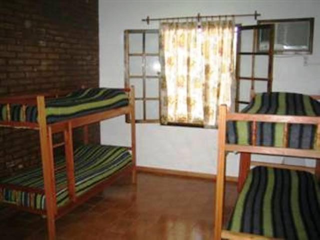 Postel nebo postele na pokoji v ubytování El Guembe Hostel House