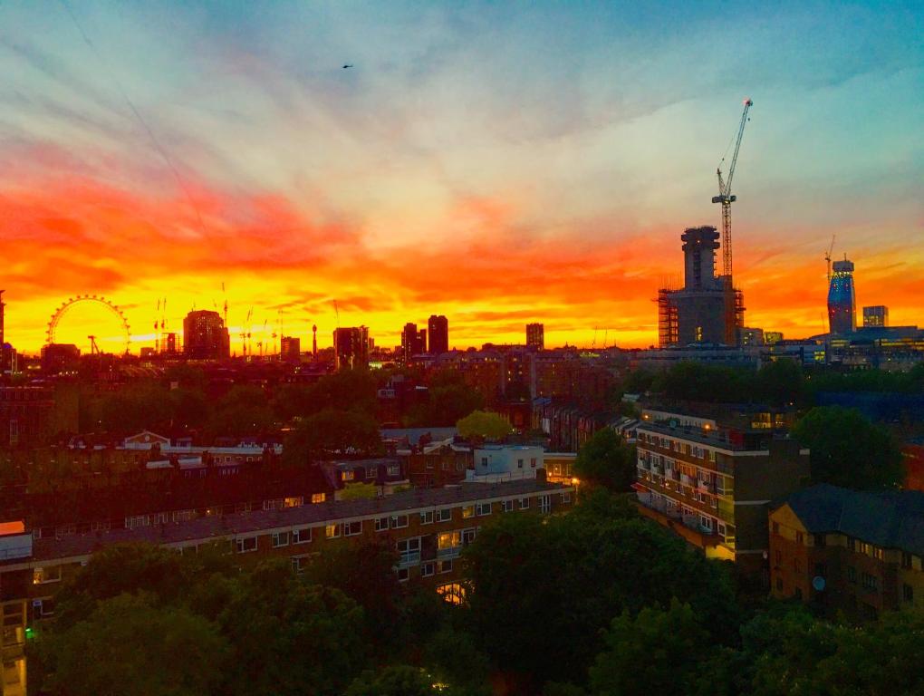 a city skyline with a sunset in the background at Prospect House in London
