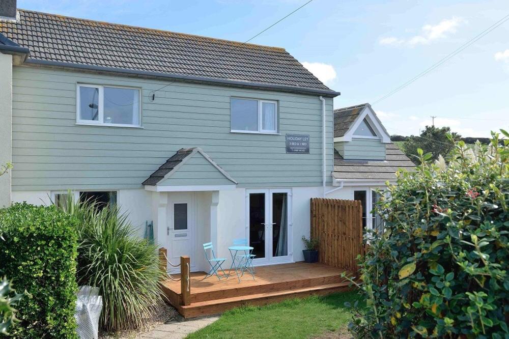 a house with a wooden deck in front of it at 2 Fernleigh Villas in Perranporth
