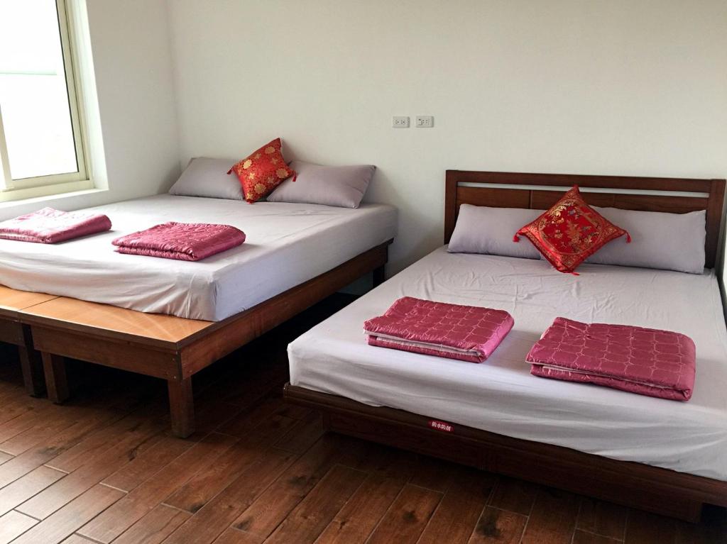 Postel nebo postele na pokoji v ubytování Fei Ying Homestay