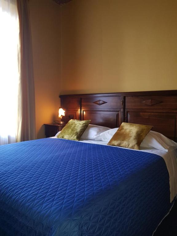 Postel nebo postele na pokoji v ubytování Hotel Damian Park Hotel Delle Magnolie