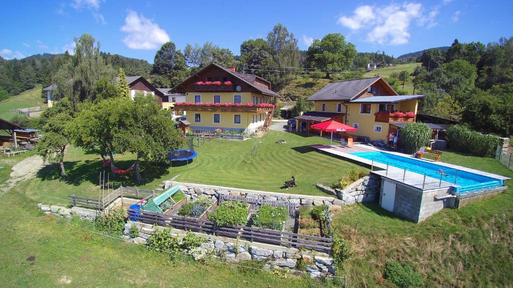 an aerial view of a house with a swimming pool at Essleggerhof in Fachau