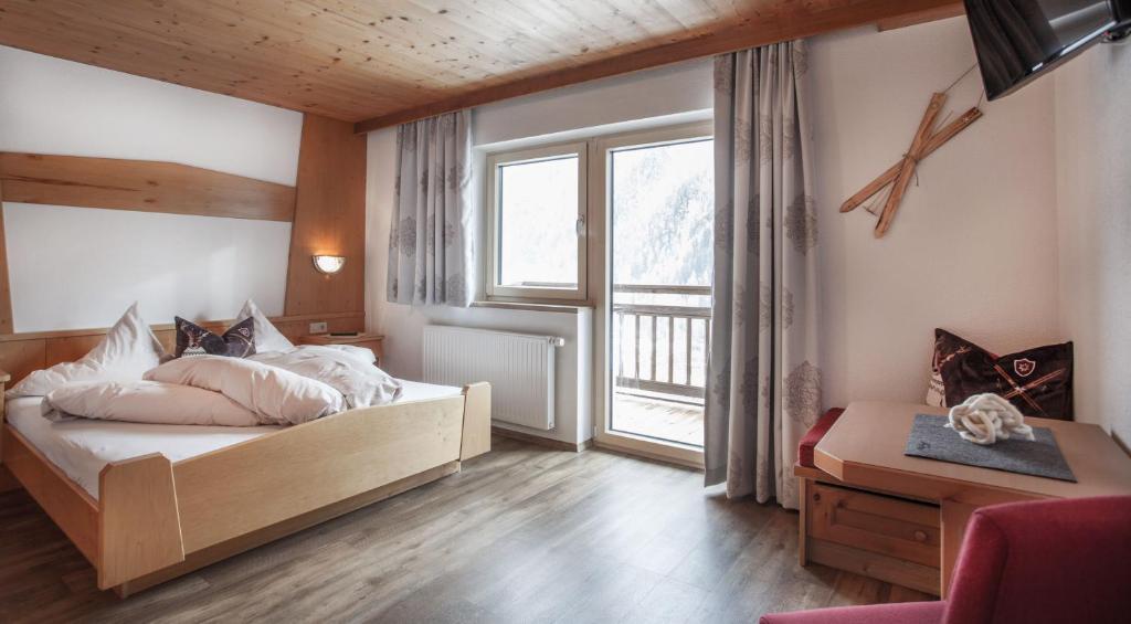 Postel nebo postele na pokoji v ubytování Apart Hotel Arno