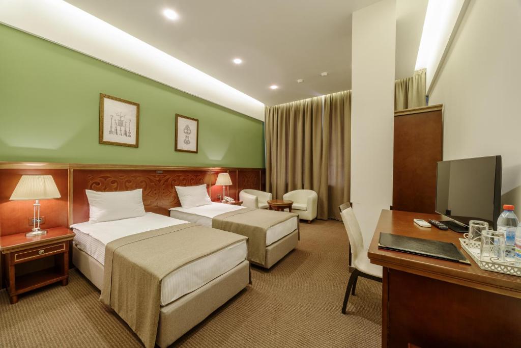 Postel nebo postele na pokoji v ubytování Alarus Luxe Hotel