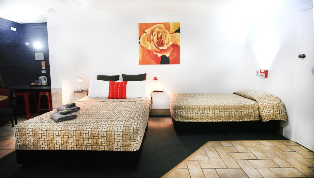 Postel nebo postele na pokoji v ubytování Central Motel Gin Gin