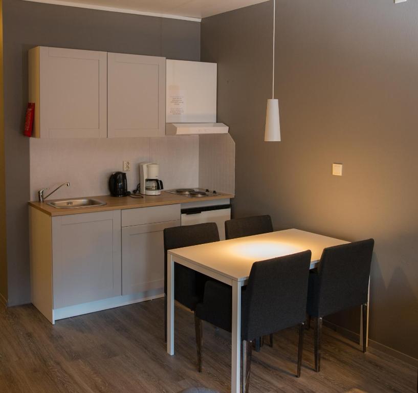 Kuchyň nebo kuchyňský kout v ubytování Oppdal Gjestetun Hotell