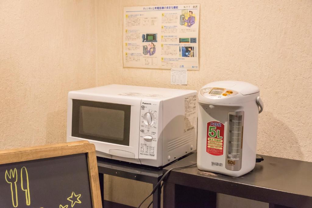 Kuchyň nebo kuchyňský kout v ubytování Oka Hotel