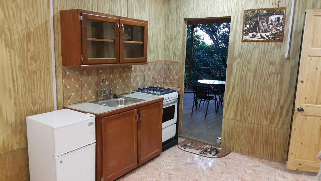 Kuchyň nebo kuchyňský kout v ubytování Cottage Mango