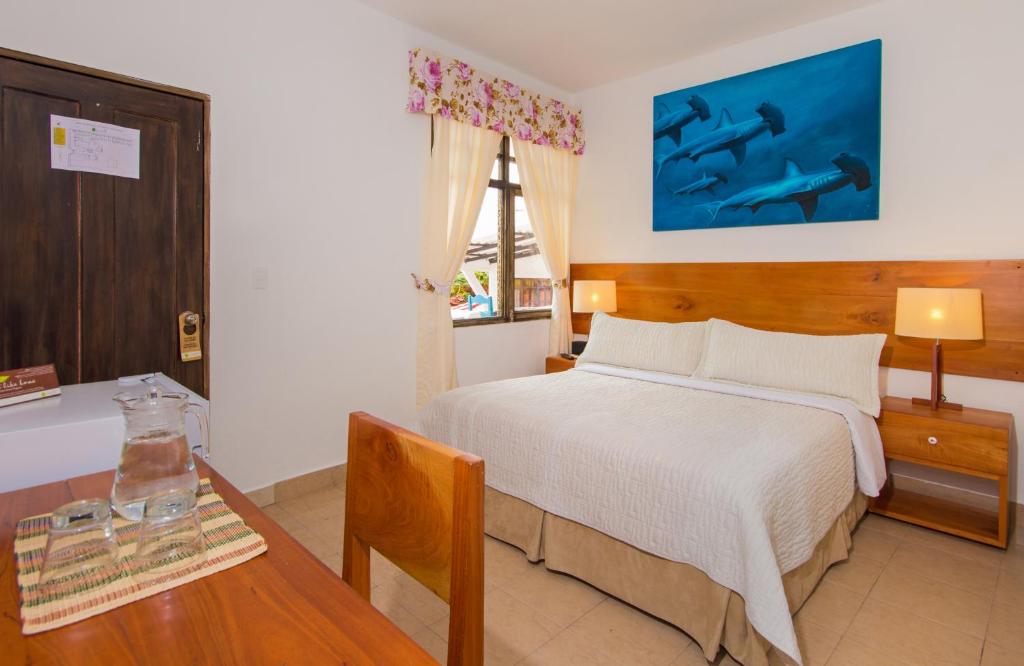 Postel nebo postele na pokoji v ubytování Hotel Fiesta