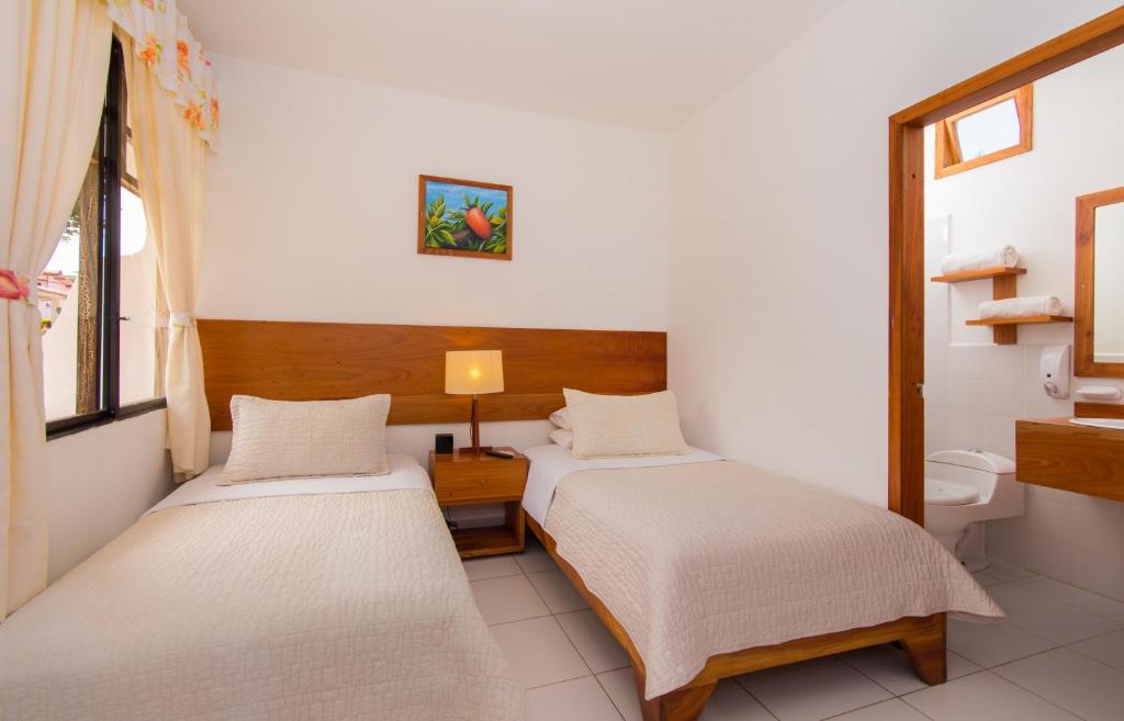 Postel nebo postele na pokoji v ubytování Hotel Fiesta