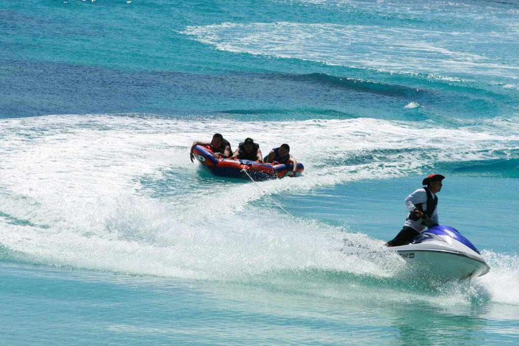 a group of people riding on a boat in the water at Kerama Terrace in Tokashiki