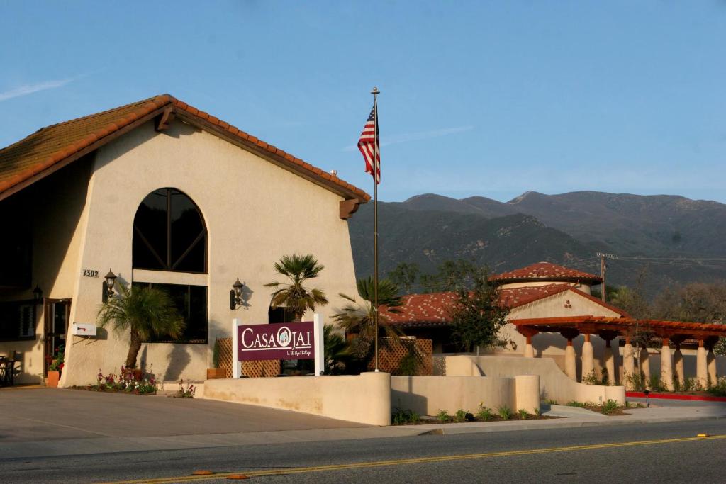 a restaurant with an american flag in front of a building at Casa Ojai Inn in Ojai