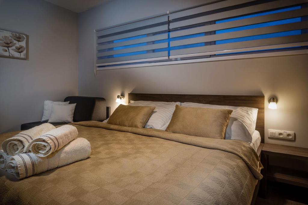 Postel nebo postele na pokoji v ubytování Apartmánový Dom Kriváň