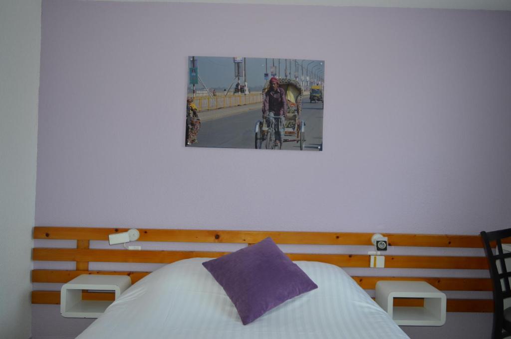 Postel nebo postele na pokoji v ubytování N'Atura Hôtel