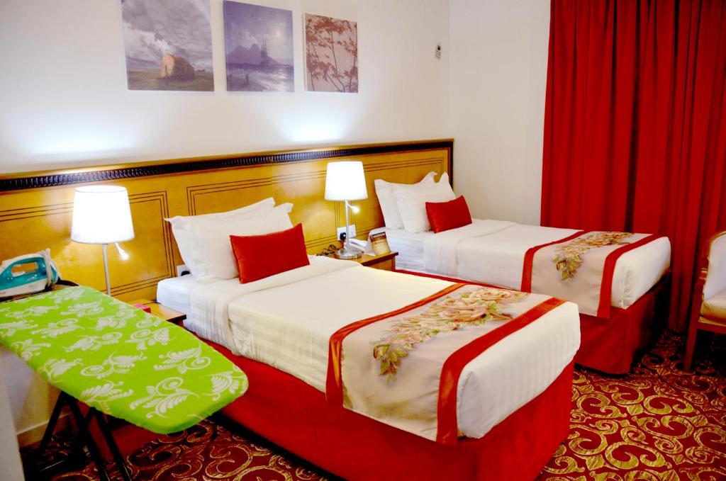 Postel nebo postele na pokoji v ubytování Amjad Al Deafah Hotel