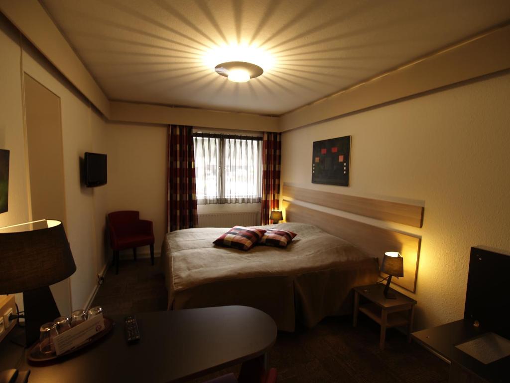 Postel nebo postele na pokoji v ubytování Rold StorKro