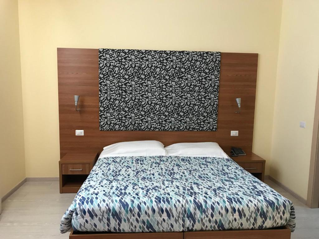 Postel nebo postele na pokoji v ubytování Hotel Elys