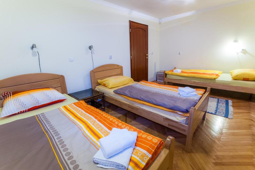 Postel nebo postele na pokoji v ubytování Apartments Kira