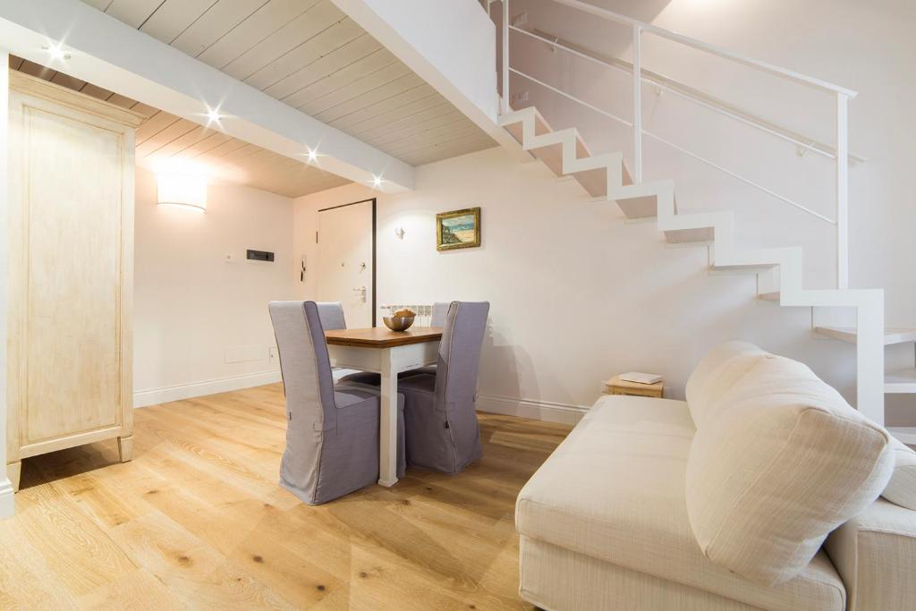 a living room with a couch and a table at Santa Croce apartment in Florence