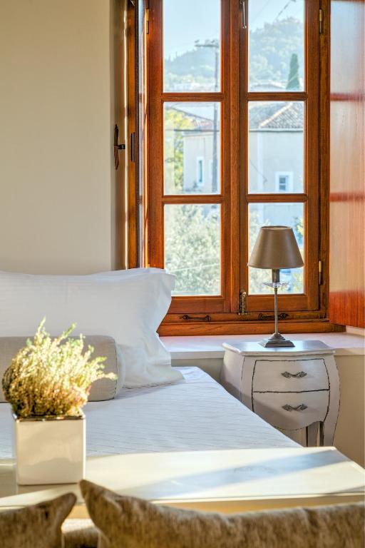 Postel nebo postele na pokoji v ubytování Mare Monte Luxury Suites