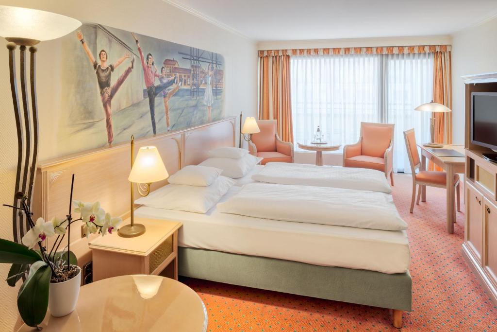 Postel nebo postele na pokoji v ubytování Hollywood Media Hotel am Kurfürstendamm