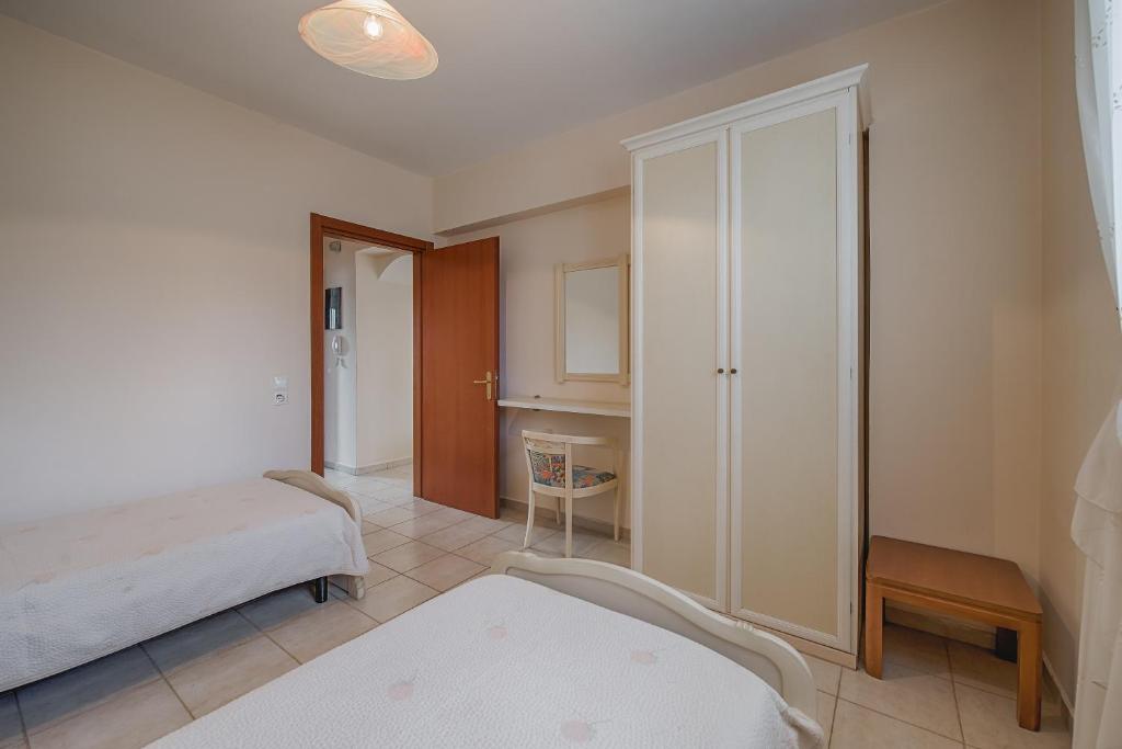 Postel nebo postele na pokoji v ubytování Athena Villa