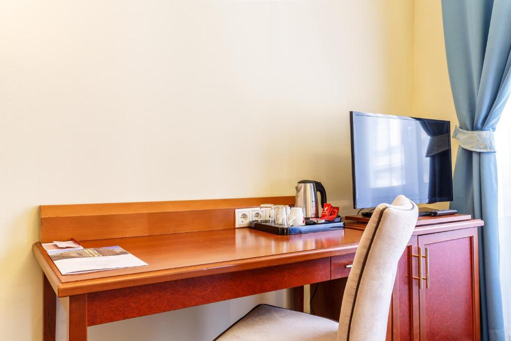 Telewizja i/lub zestaw kina domowego w obiekcie Hotel Bellevue Wien
