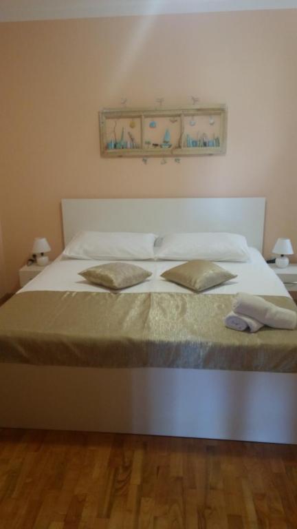 Postel nebo postele na pokoji v ubytování Rooms Vukušić