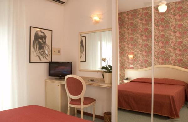 Postel nebo postele na pokoji v ubytování Hotel Igea Spiaggia