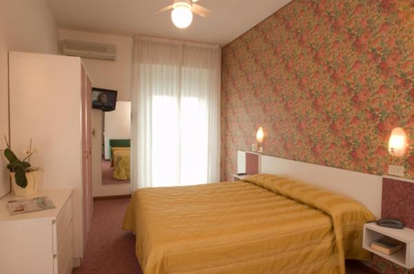 Postel nebo postele na pokoji v ubytování Hotel Igea Spiaggia
