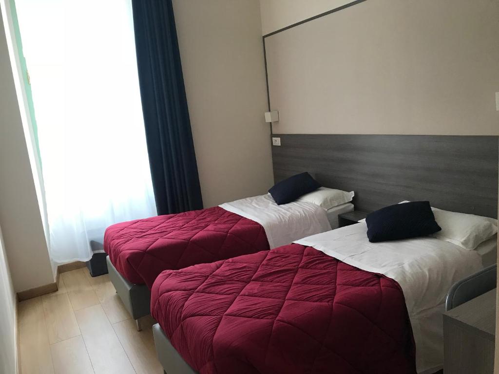 Postel nebo postele na pokoji v ubytování Boutique Hôtel Neptune Nice