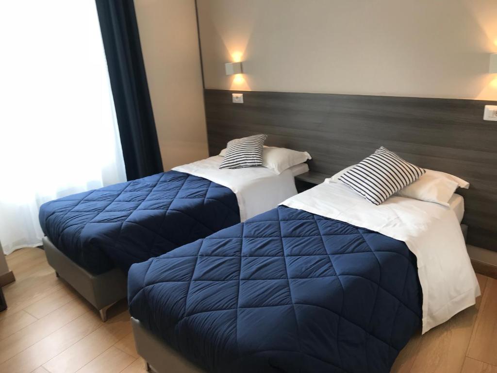 Postel nebo postele na pokoji v ubytování Boutique Hôtel Neptune Nice