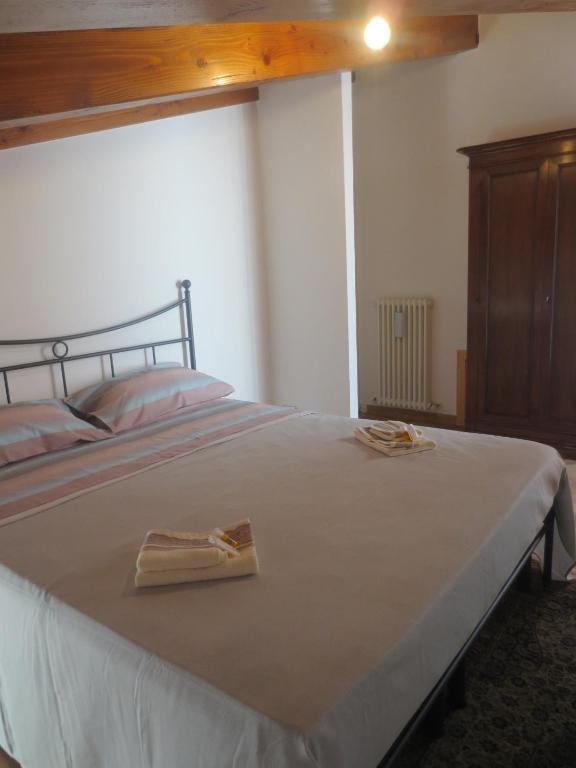 Łóżko lub łóżka w pokoju w obiekcie Vista Alpi Apuane