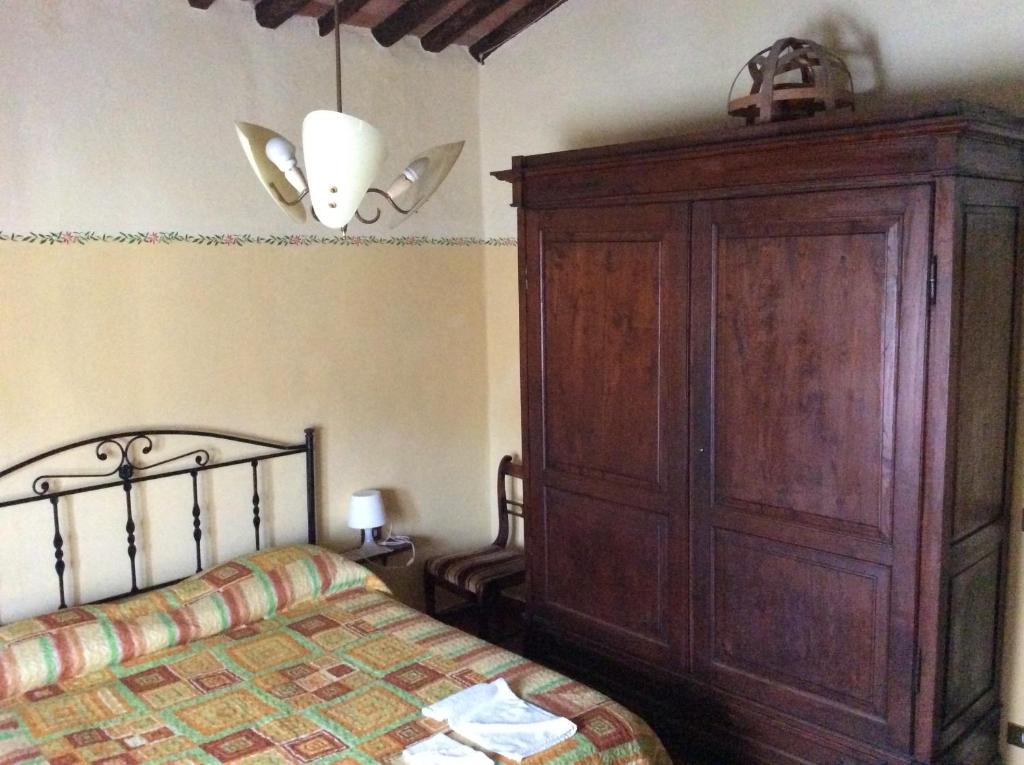 Łóżko lub łóżka w pokoju w obiekcie B&B e Locazioni Turistiche Antico Borgo Toscano