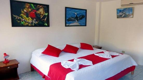 Postel nebo postele na pokoji v ubytování Hostal Sandrita