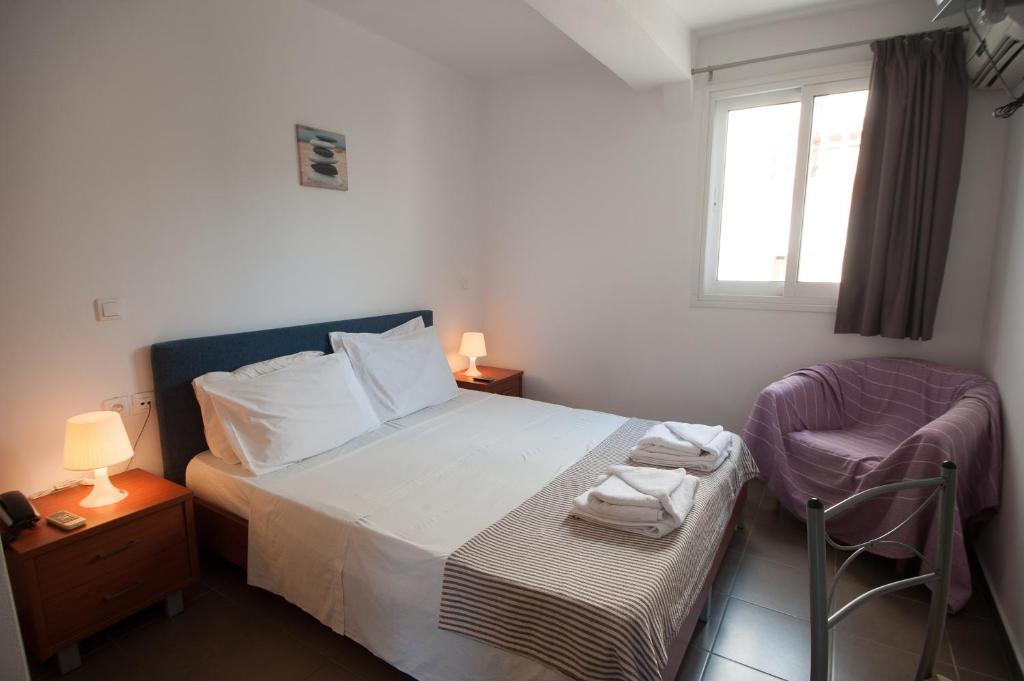 Posteľ alebo postele v izbe v ubytovaní Elounda Sunrise Apartments