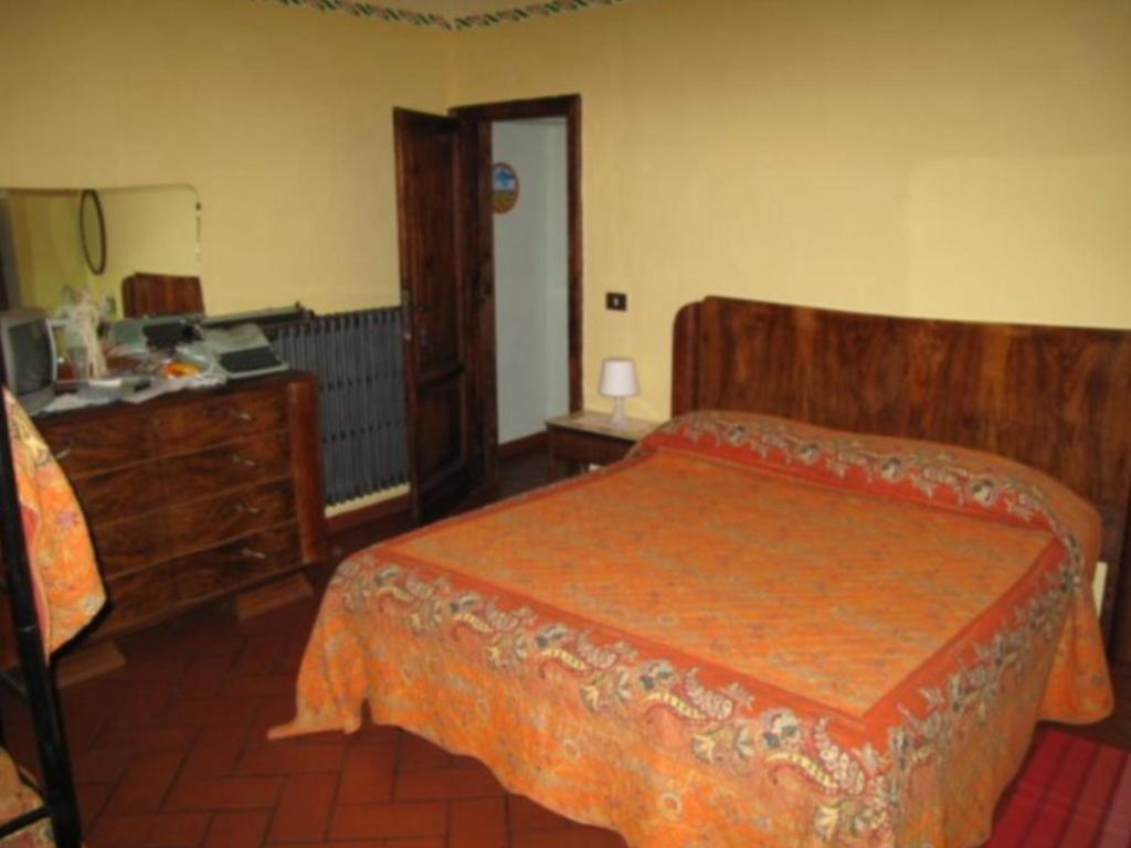 Łóżko lub łóżka w pokoju w obiekcie B&B e Locazioni Turistiche Antico Borgo Toscano