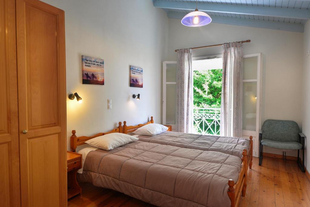 Postel nebo postele na pokoji v ubytování Valentino Corfu