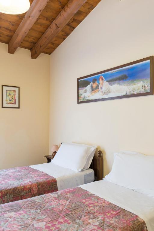 Postel nebo postele na pokoji v ubytování Hotel Conca Verde