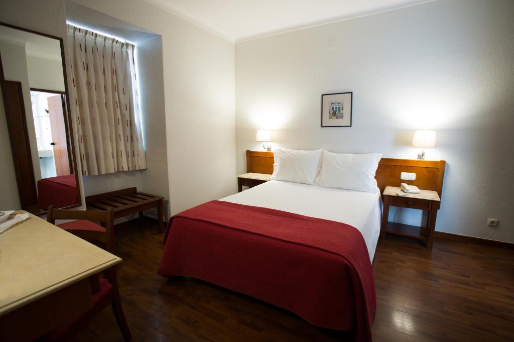 Postel nebo postele na pokoji v ubytování Hotel Solaris