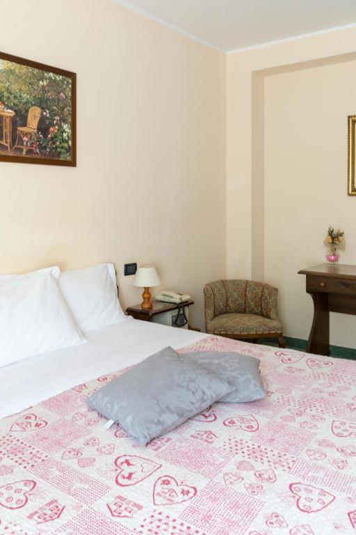Postel nebo postele na pokoji v ubytování Hotel Conca Verde